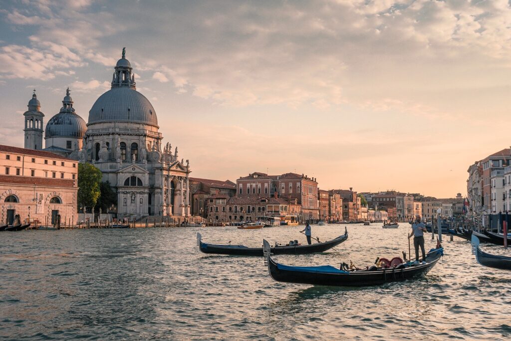 Gondoliers on the channel in Venice