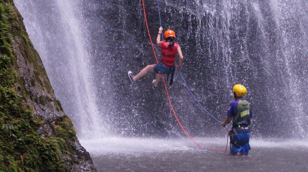 Girl Abseiling Waterfall